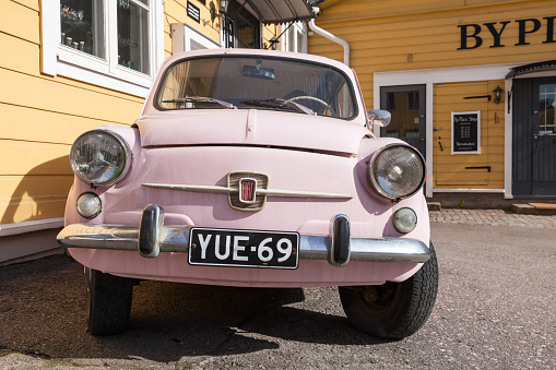 Porvoo, Finland - May 7, 2016: Old pink Fiat 600 city car produced by the Italian manufacturer Fiat from 1955 to 1969, close-up photo rear view