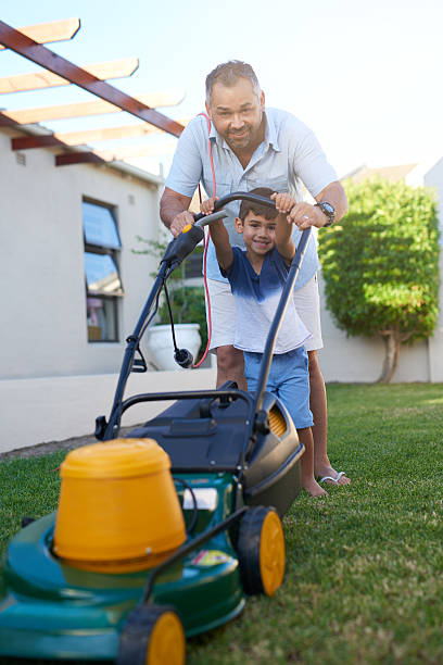 istock I’m old enough now to help dad mow the lawn 530207368
