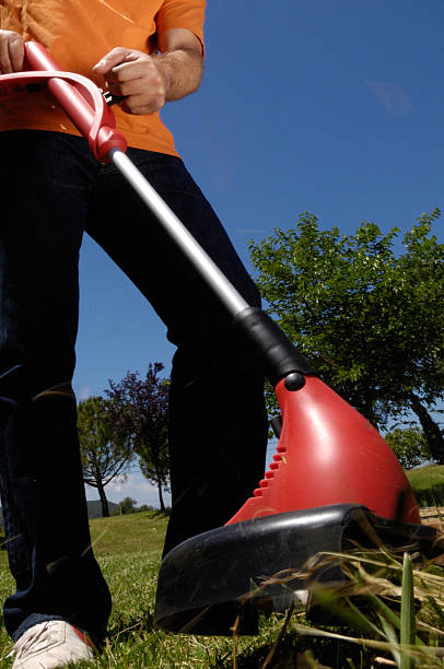 istock Man mowing the grass, mower close up 530207637