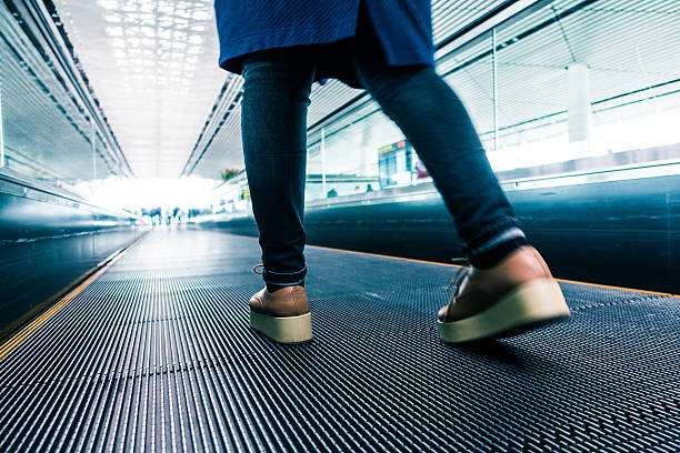 istock Traveler walking in airport 530208838