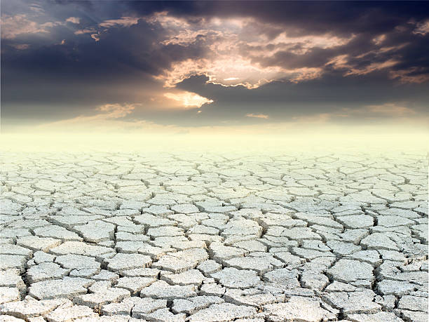istock Cracked ground and sunset dark tone 530209260