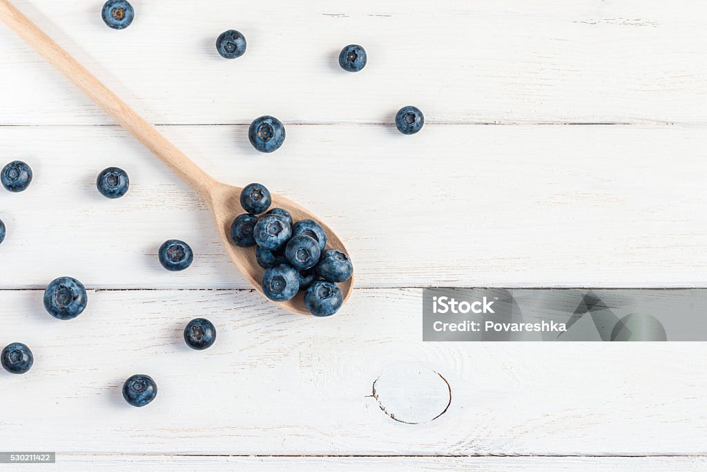 blueberry on wooden spoon, flat lay, top view Blueberry Stock Photo