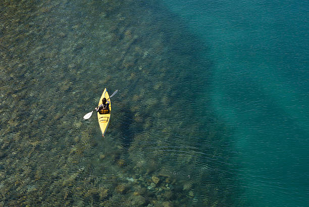 Crossing Kayak Paddling the Lakes of Patagonia, Argentina. stock photo