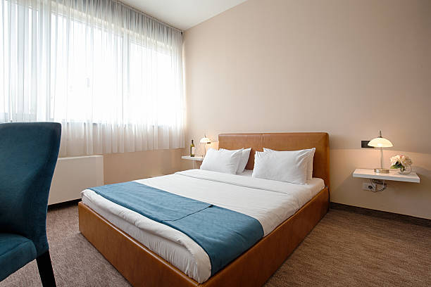 istock Elegant hotel bedroom interior 530212322
