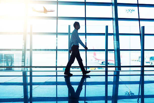 istock man walking at airport 530213060