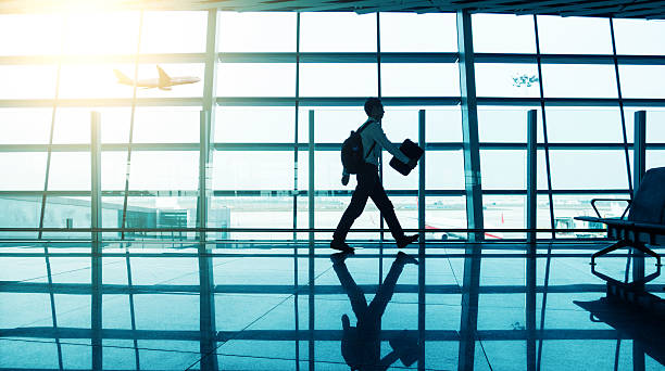 istock man walking at airport 530213228