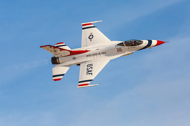 USAF Thunderbirds perform air show routine Las Vegas, USA - November 8, 2014: USAF Thunderbirds perform air show routine during Aviation Nation at Nellis AFB on November 8,2014 in Las Vegas,NV. Squadron is the official air demonstration team for the USAF.  supersonic airplane editorial airplane air vehicle stock pictures, royalty-free photos & images