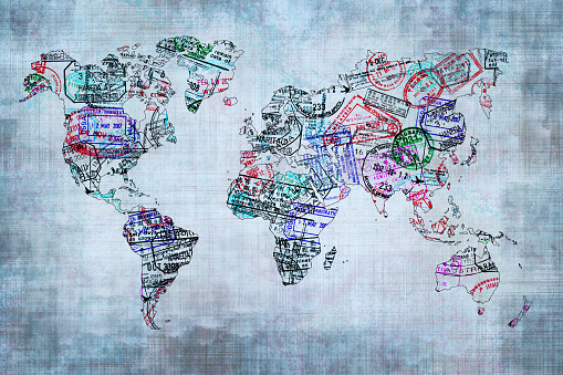 World map created with passport stamps, travel concept