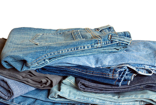 istock Many jeans isolated on white close-up 530224429