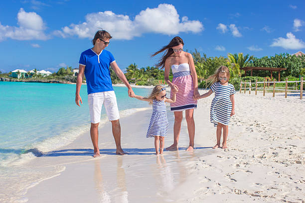 istock Happy family of four during beach vacation 530224723