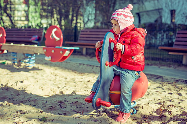 istock baby playing at the playground 530224823