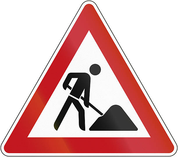 Building Site German sign warning about a building site at the road. hazard sign photos stock pictures, royalty-free photos & images