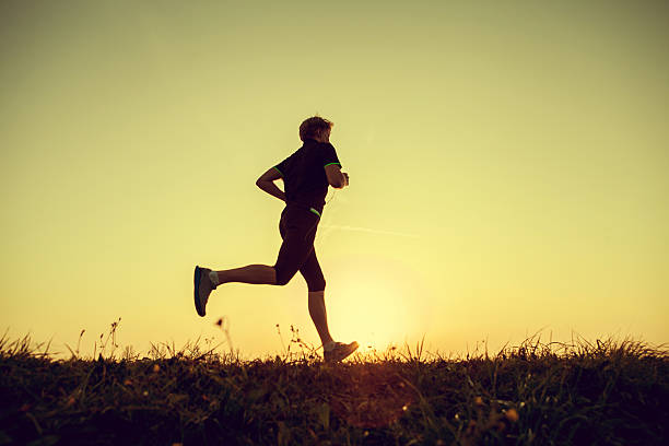 istock Running man silhouette in sunset time 530225429