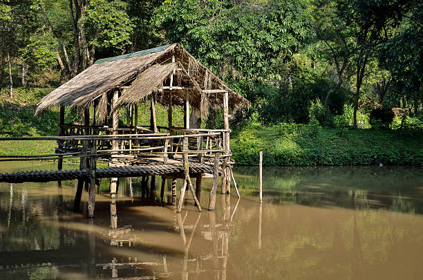 istock Old wooden house on the river 530227311