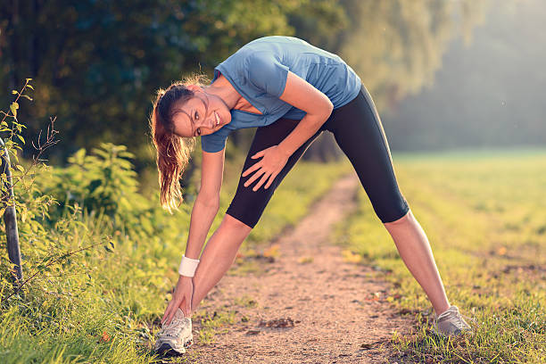 istock Young woman doing stretching exercises 530227327