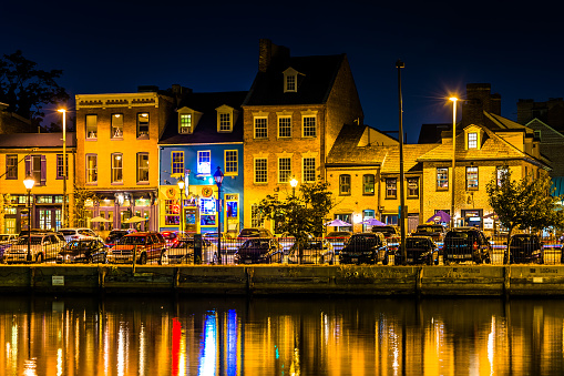 Shops and restaurants at night in Fells Point, Baltimore, Maryland.