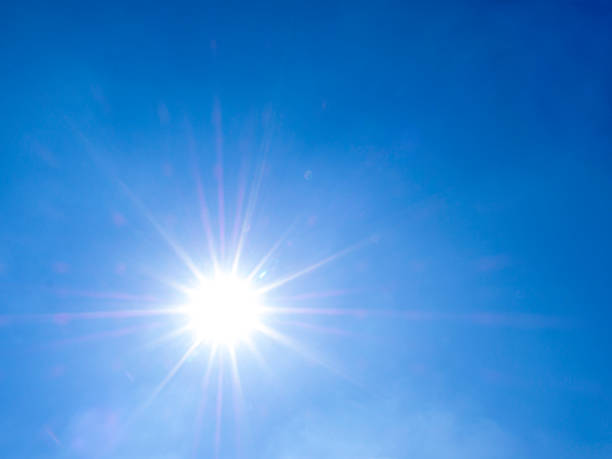 istock lens flare in the afternoon on blue sky 530236839