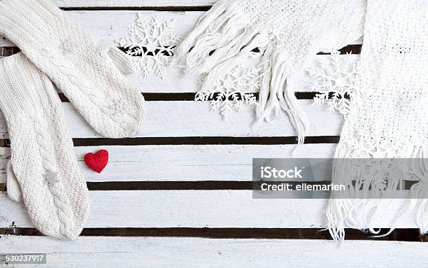White Mittens And Scarf On A Wooden Plank Background Stock Photo - Download Image Now