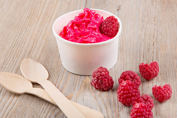 istock Frozen creamy ice yoghurt  with whole raspberries 530238045