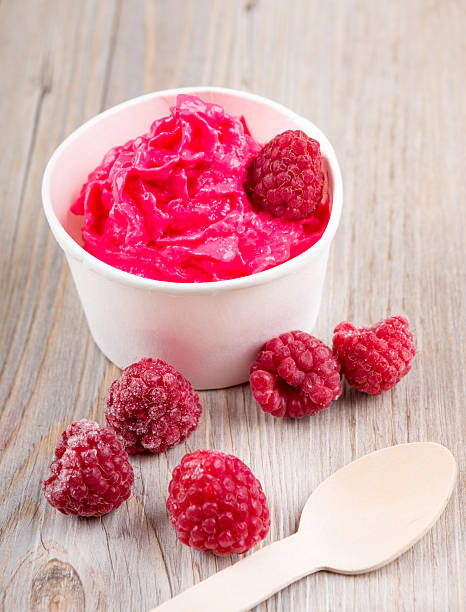 istock Frozen creamy ice yoghurt  with whole raspberries 530238085