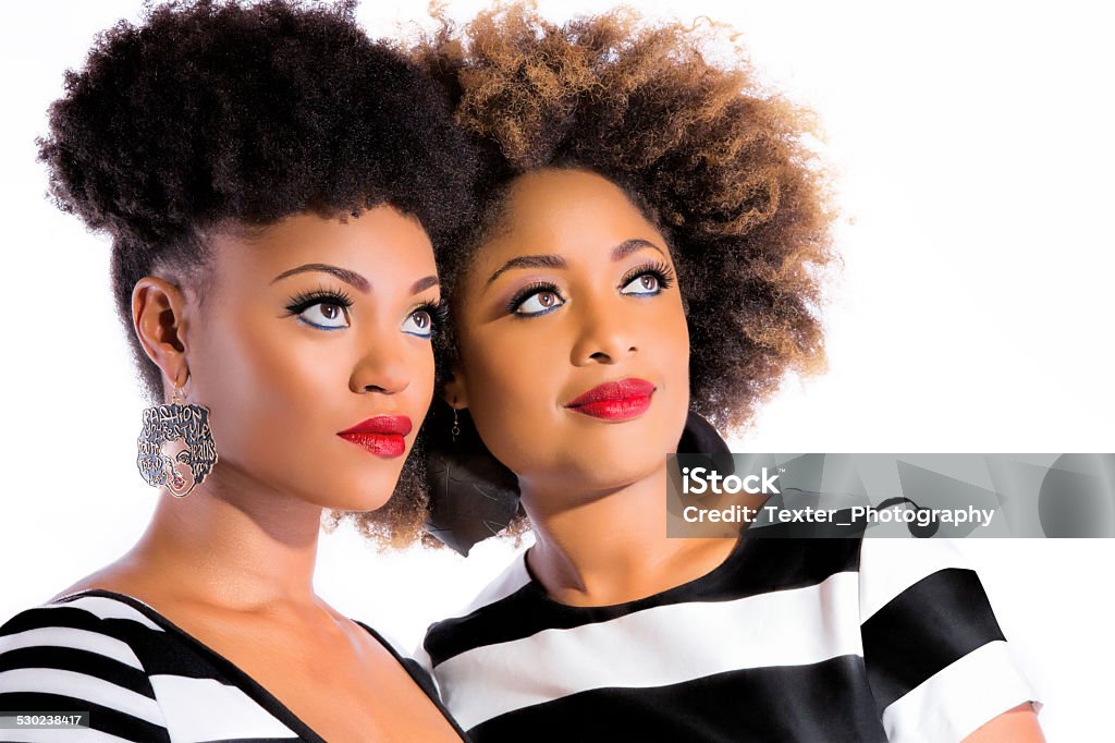 Two Elegant Beautiful Woman Cheek to Cheek Beauty shot of two ladies Red Stock Photo