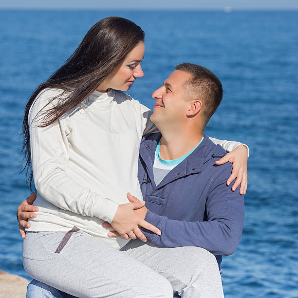 istock Attractive couple on seashore 530240661