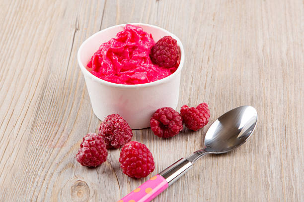 istock Frozen creamy ice yoghurt  with whole raspberries 530241319