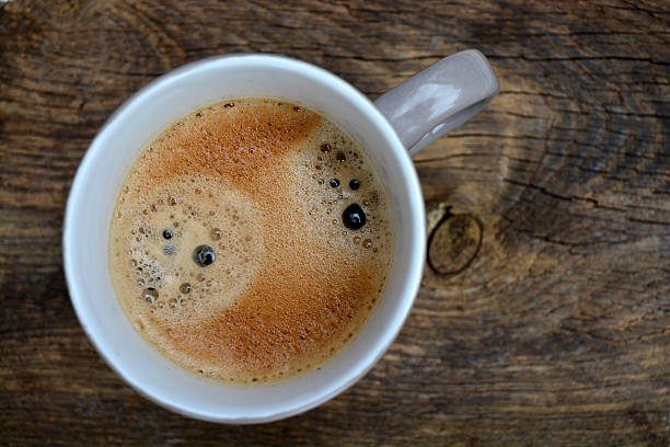 istock Grey Coffee cup on old used wood with coffeefoam 530241399