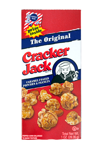Richmond, Virginia, United States- December 25, 2014: Cracker Jack, a sweet and salt blend of peanuts, popcorn, and molasses, was first introduced to the public in 1893 at the Chicago Worlds Fair. Today, Cracker Jack is a product of Frito-Lay. 