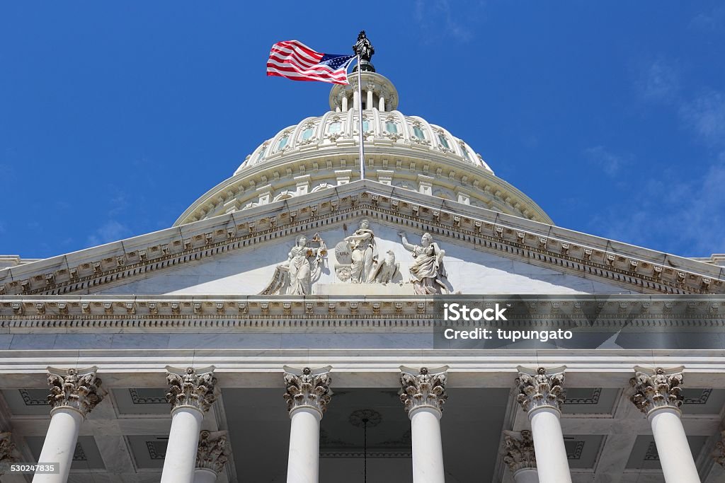 Washington DC Washington DC, capital city of the United States. National Capitol building with US flag. American Culture Stock Photo