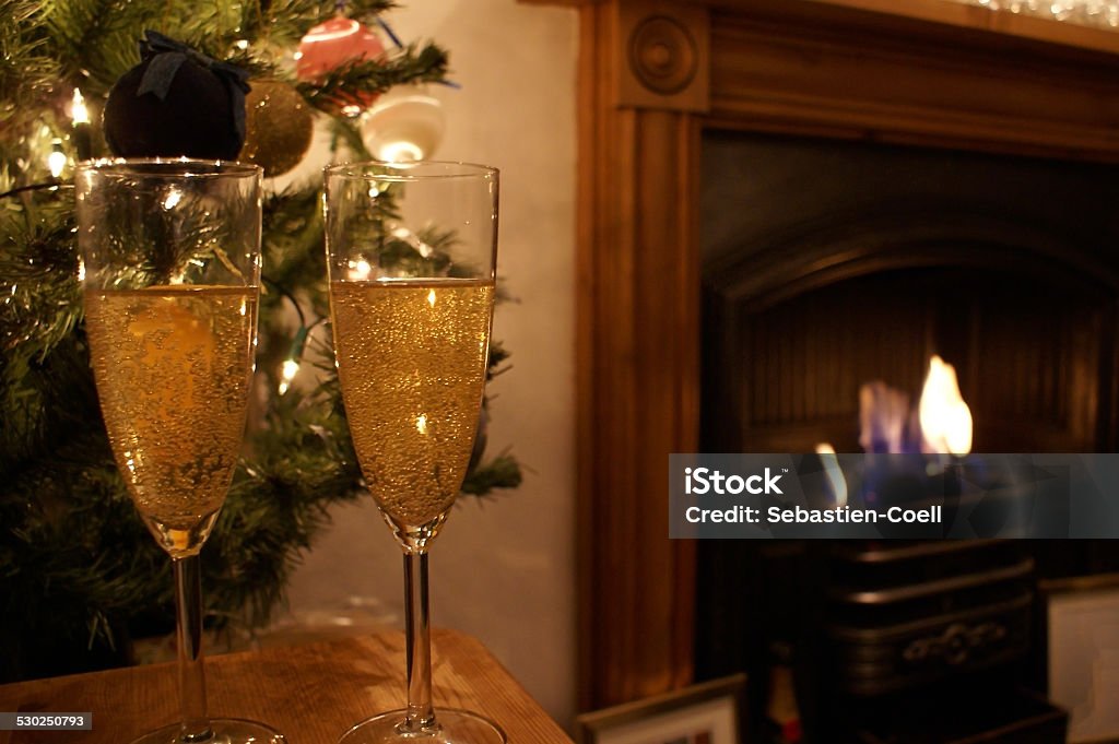 Wine glasses Christmas 2 wine glasses shown by a Christmas tree and a fire Alcohol - Drink Stock Photo