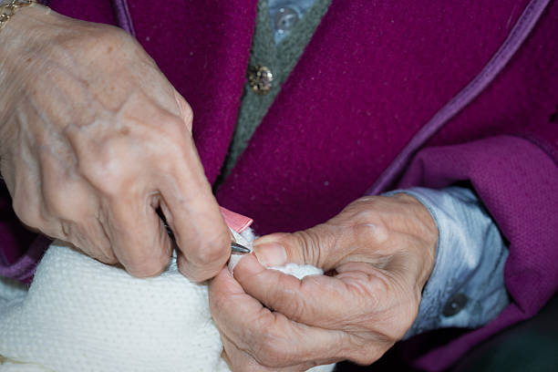 istock older woman crocheting 530251633