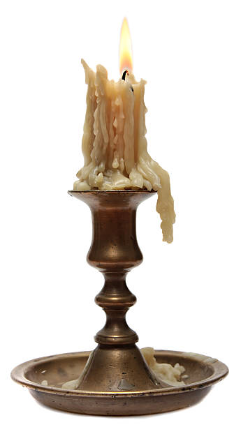 istock burning old candle vintage bronze candlestick. 530252141