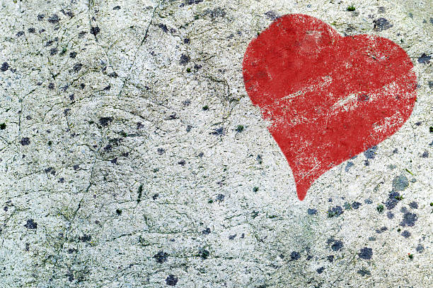 istock red heart painted on gray rock surface texture, love background 530253949
