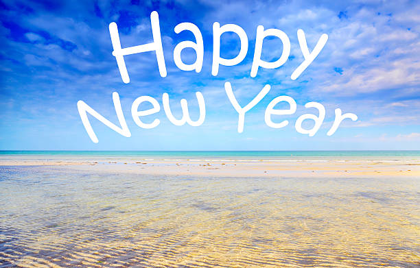 istock Happy New Year message in sky over beach. 530254313