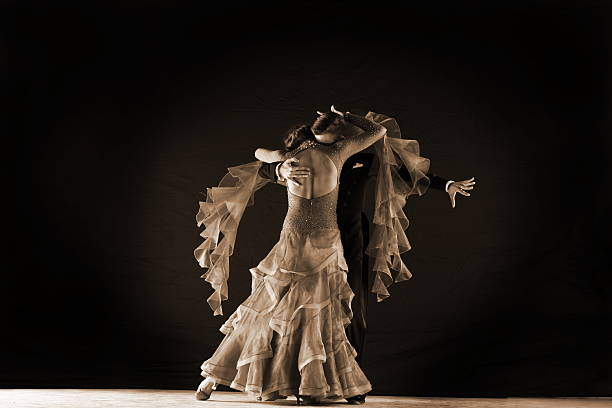 istock dancers in ballroom isolated on black background 530257161