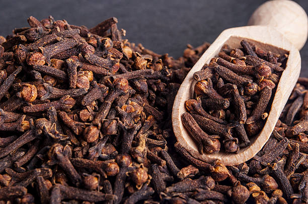istock Wooden shovel with cloves scattered from it 530258273