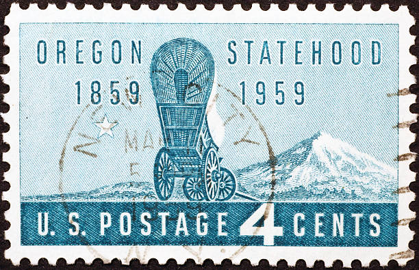 istock Conestoga wagon on old american postage stamp 530260413