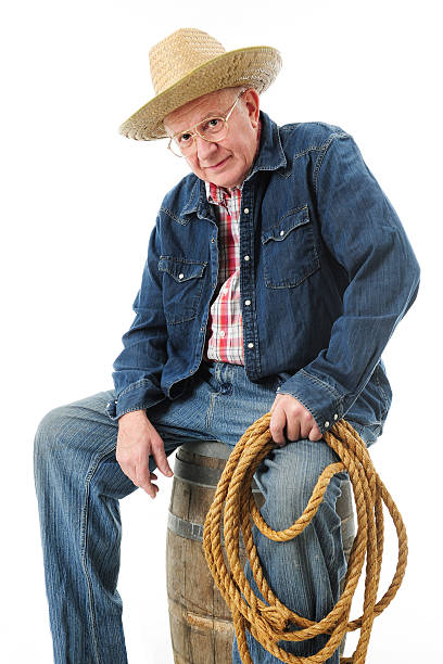 istock Senior Cowboy Taking a Break 530261031