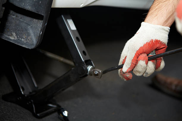 istock Car mechanic changing tire. 530261439