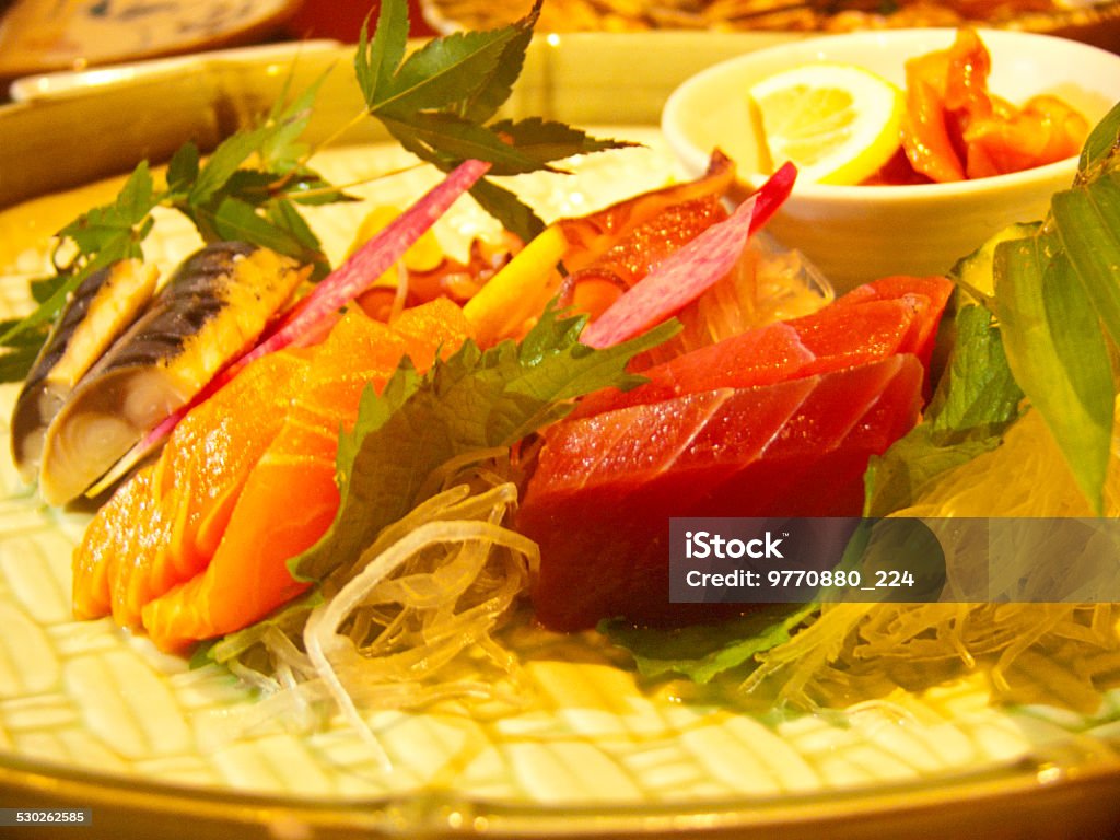 Tuna Sashimi - Maguro (fresh raw tuna)Garnished with Ginger, Wasabi Asian and Indian Ethnicities Stock Photo