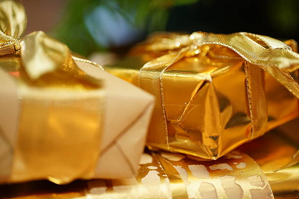 istock Golden gift box under the fir 530263625