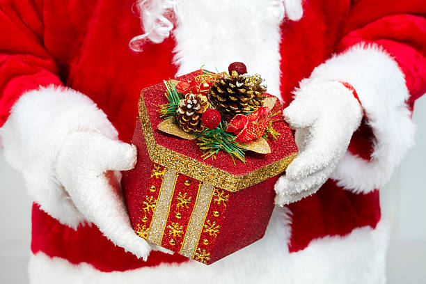 istock Hands of Santa Claus with gift 530263667