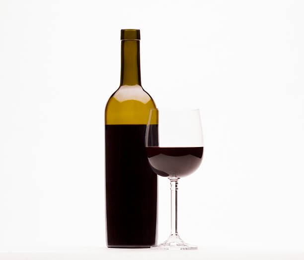 istock Red wine and wine glass isolated on white 530264229