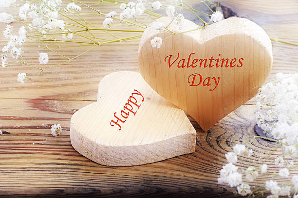istock two hearts on old wood, message happy valentines day 530268169