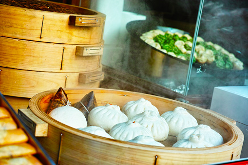 This photo is steamed buns in Chinatown storefront.