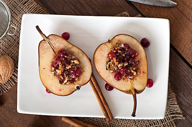 istock Baked pears with cranberries, honey and walnuts 530270987