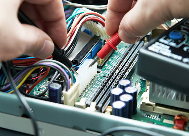 istock Close-up of a technician hands with multimeter. 530273221