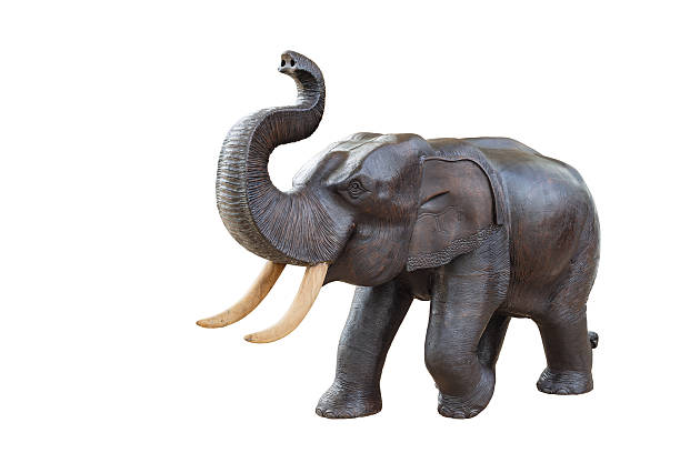 istock handcraft wood elephant sculpture isolated on white background 530274537
