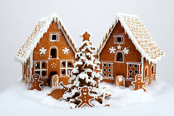 The hand-made eatable gingerbread houses and New Year Tree stock photo